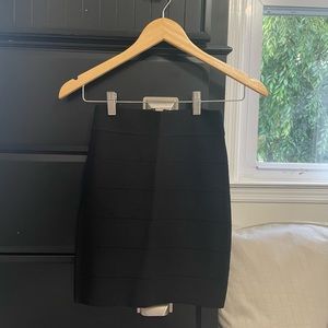Black bandage solid skirt. Size XS. Brand: Bebe. Never worn tags still on